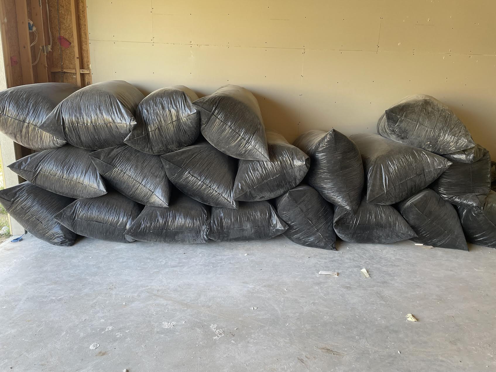 Bagged construction debris prepared for hauling